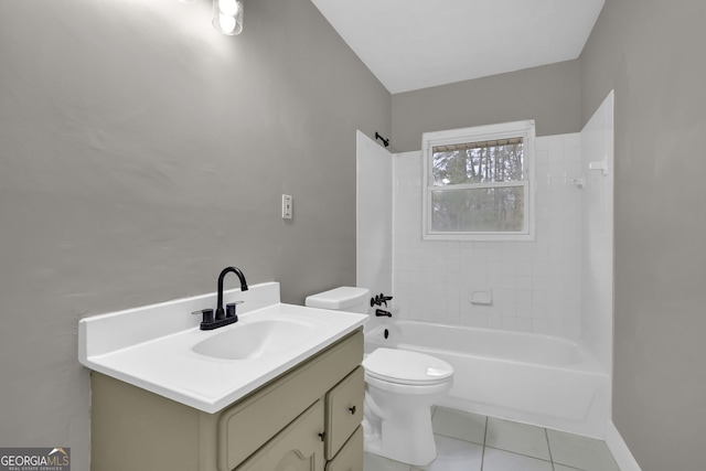 full bathroom with toilet, vanity, tiled shower / bath, and tile patterned flooring