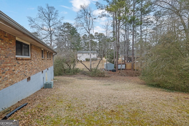 view of yard featuring central AC