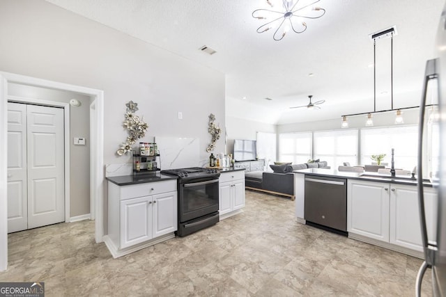 kitchen with ceiling fan, pendant lighting, sink, white cabinetry, and stainless steel appliances