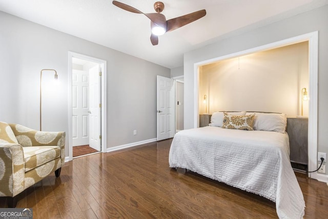 bedroom with ceiling fan and dark hardwood / wood-style flooring