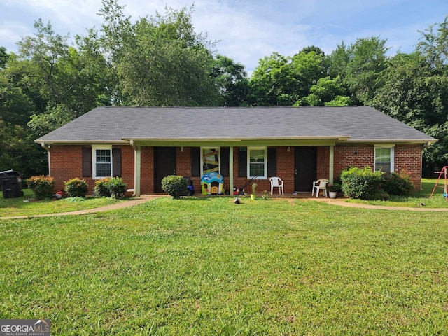 ranch-style home featuring a front yard