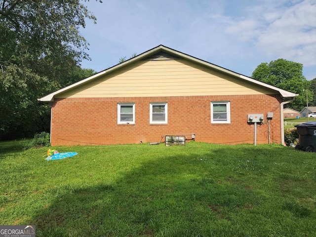 view of home's exterior featuring a lawn