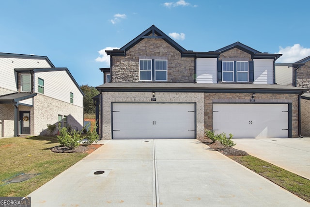 view of front of house with a garage and a front yard