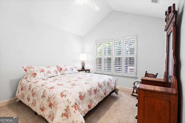 bedroom featuring vaulted ceiling, ceiling fan, and light colored carpet