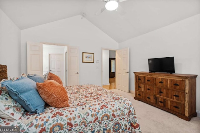 carpeted bedroom featuring ceiling fan and high vaulted ceiling