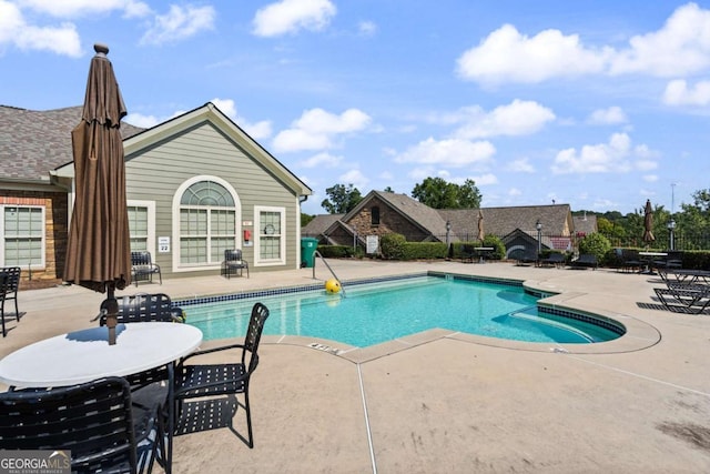 view of swimming pool featuring a patio