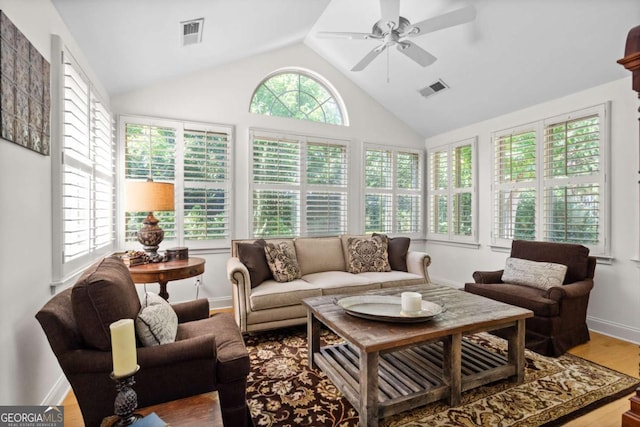 sunroom featuring vaulted ceiling and ceiling fan