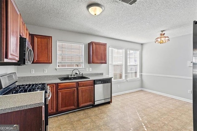 kitchen with appliances with stainless steel finishes and sink