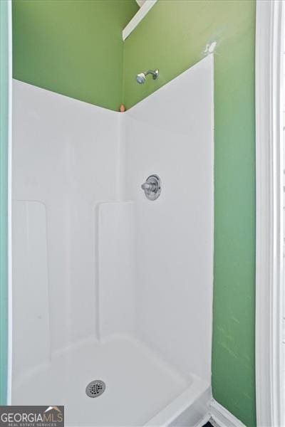 bathroom featuring walk in shower