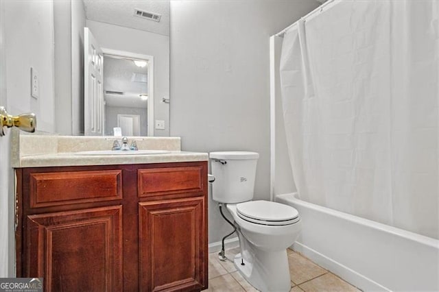 full bathroom with tile patterned floors, vanity, toilet, and shower / bath combination with curtain