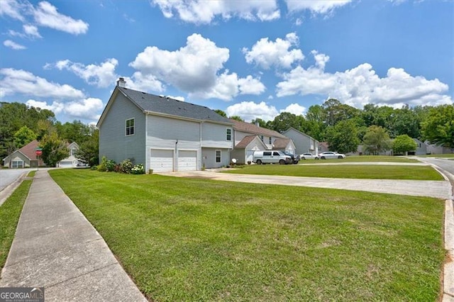 exterior space featuring a front yard and a garage