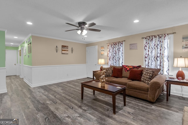 living room featuring ornamental molding, dark hardwood / wood-style floors, and ceiling fan