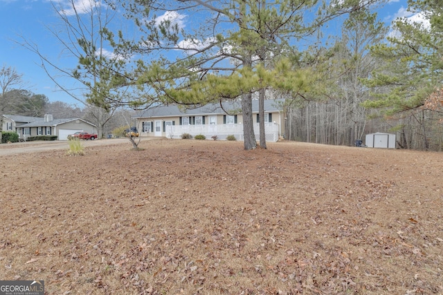 view of front facade featuring a storage shed