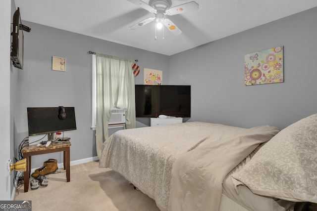 bedroom featuring light carpet and ceiling fan