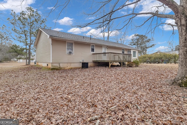 back of property with a wooden deck and cooling unit