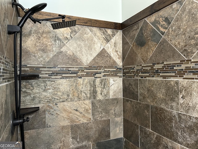 room details with a tile shower