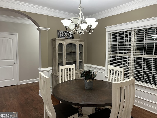 dining room featuring an inviting chandelier, dark hardwood / wood-style flooring, and crown molding