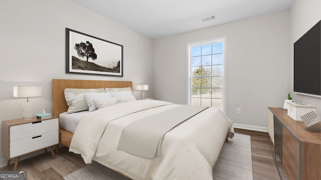 bedroom featuring dark hardwood / wood-style floors