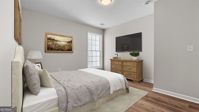 bedroom featuring hardwood / wood-style floors