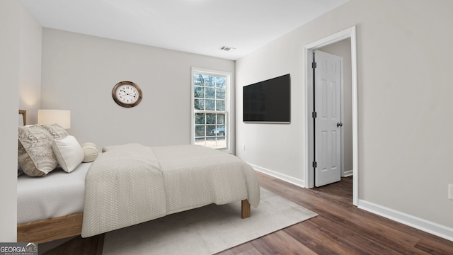 bedroom featuring dark hardwood / wood-style floors