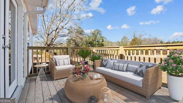 wooden terrace with outdoor lounge area