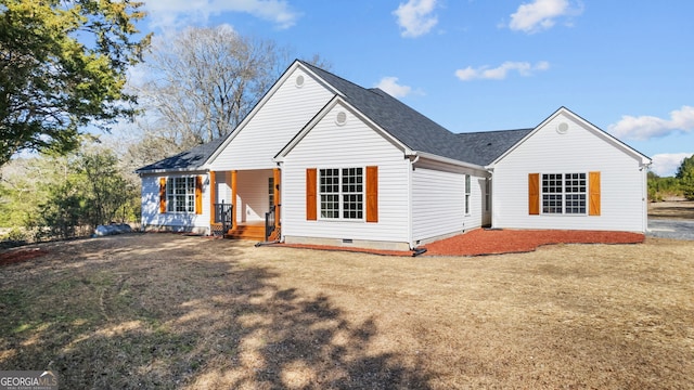 view of front of home with a front yard and a porch