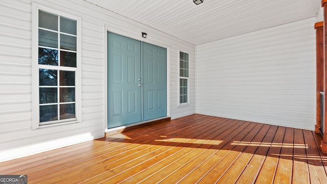 wooden terrace with a porch