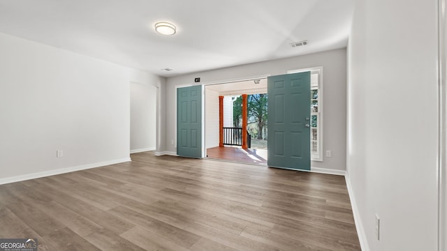 foyer entrance with hardwood / wood-style flooring