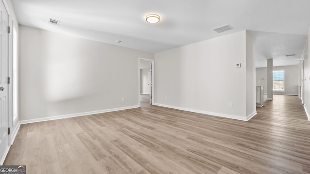 spare room with light hardwood / wood-style floors