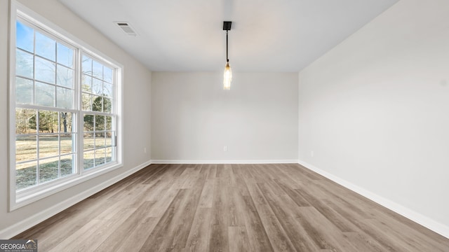 spare room featuring light hardwood / wood-style floors