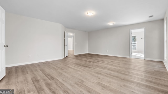 empty room with light wood-type flooring