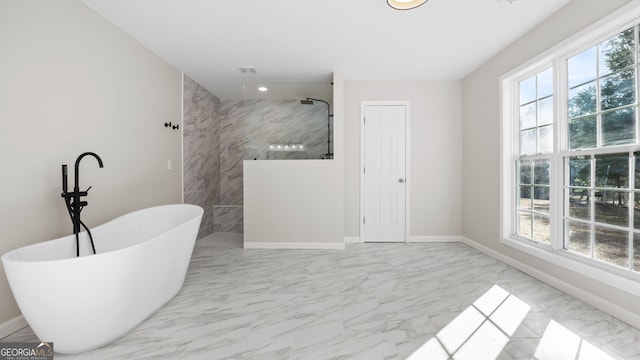 bathroom with separate shower and tub