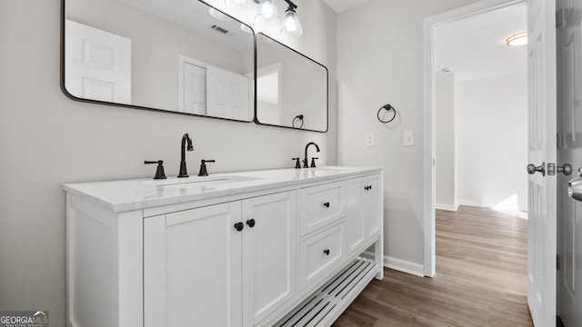 bathroom featuring vanity and wood-type flooring