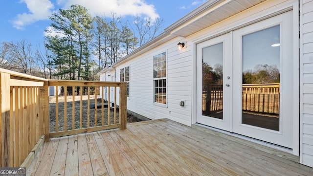 wooden deck featuring french doors