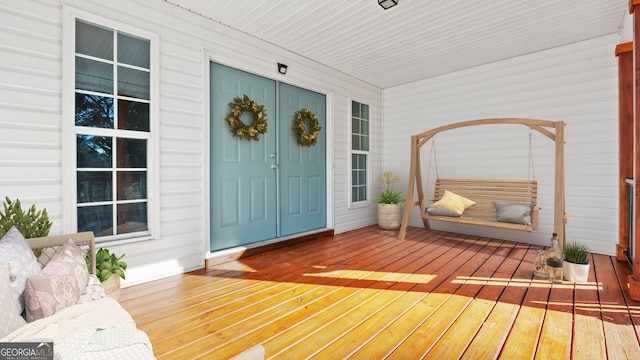 doorway to property featuring covered porch