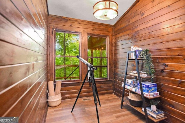 misc room featuring lofted ceiling and hardwood / wood-style floors