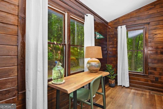 sunroom featuring lofted ceiling