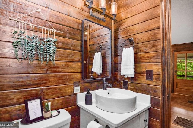 bathroom featuring toilet and vanity