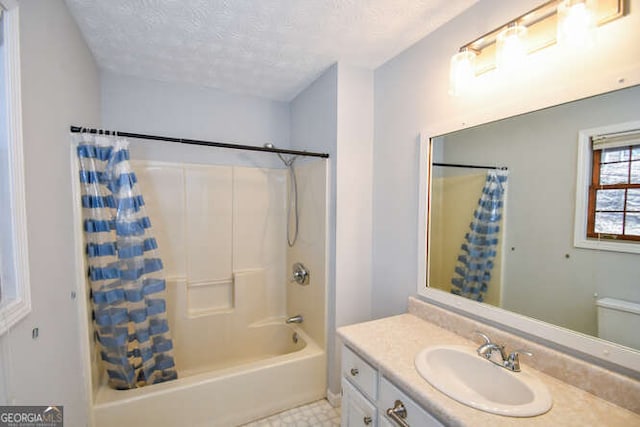 full bathroom with a textured ceiling, toilet, vanity, and shower / bath combo