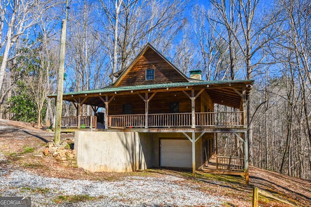 log cabin featuring a garage