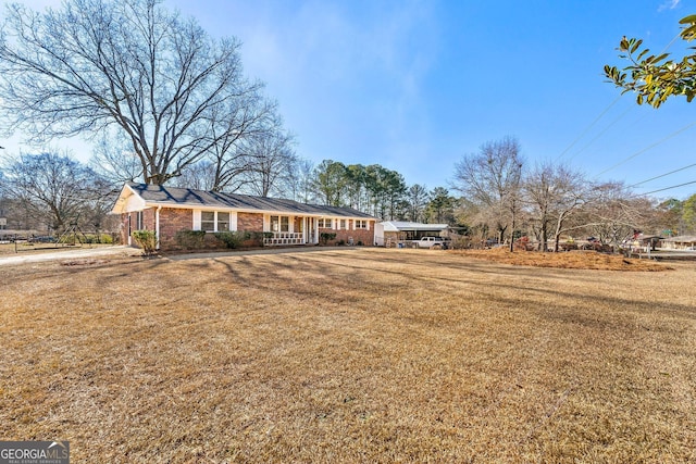 ranch-style house with a front lawn