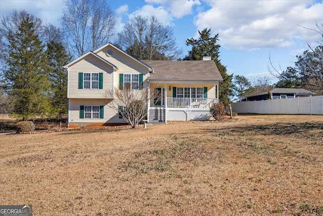 split level home featuring a front lawn and a porch