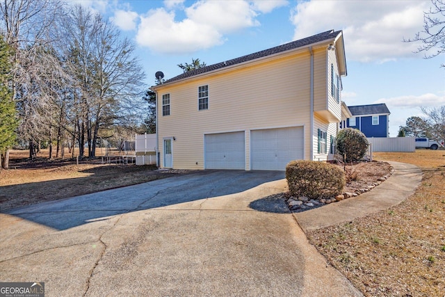 view of property exterior with a garage