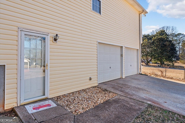 view of exterior entry featuring a garage