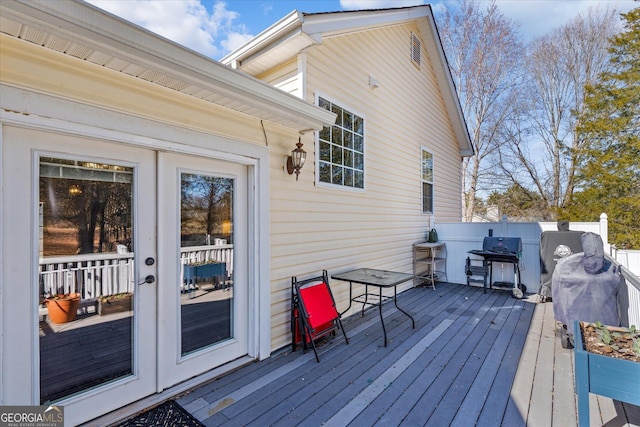 deck featuring french doors and area for grilling