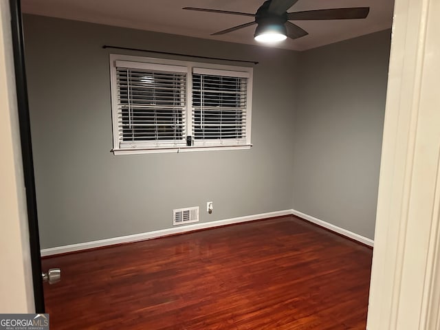 empty room featuring ceiling fan and hardwood / wood-style floors