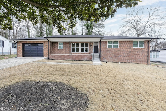 ranch-style home with a garage and a front yard