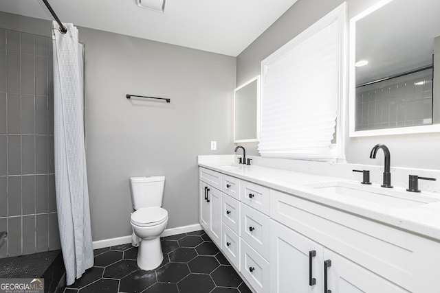 bathroom with tile patterned floors, toilet, a shower with shower curtain, and vanity