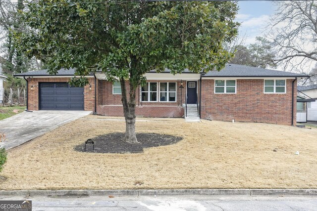 ranch-style house featuring a garage