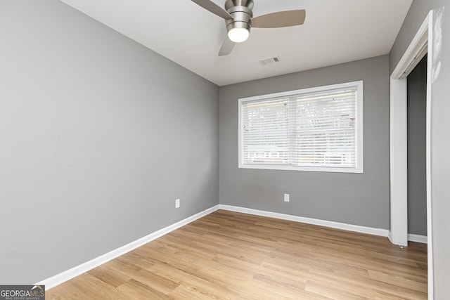 unfurnished bedroom featuring ceiling fan and light wood-type flooring